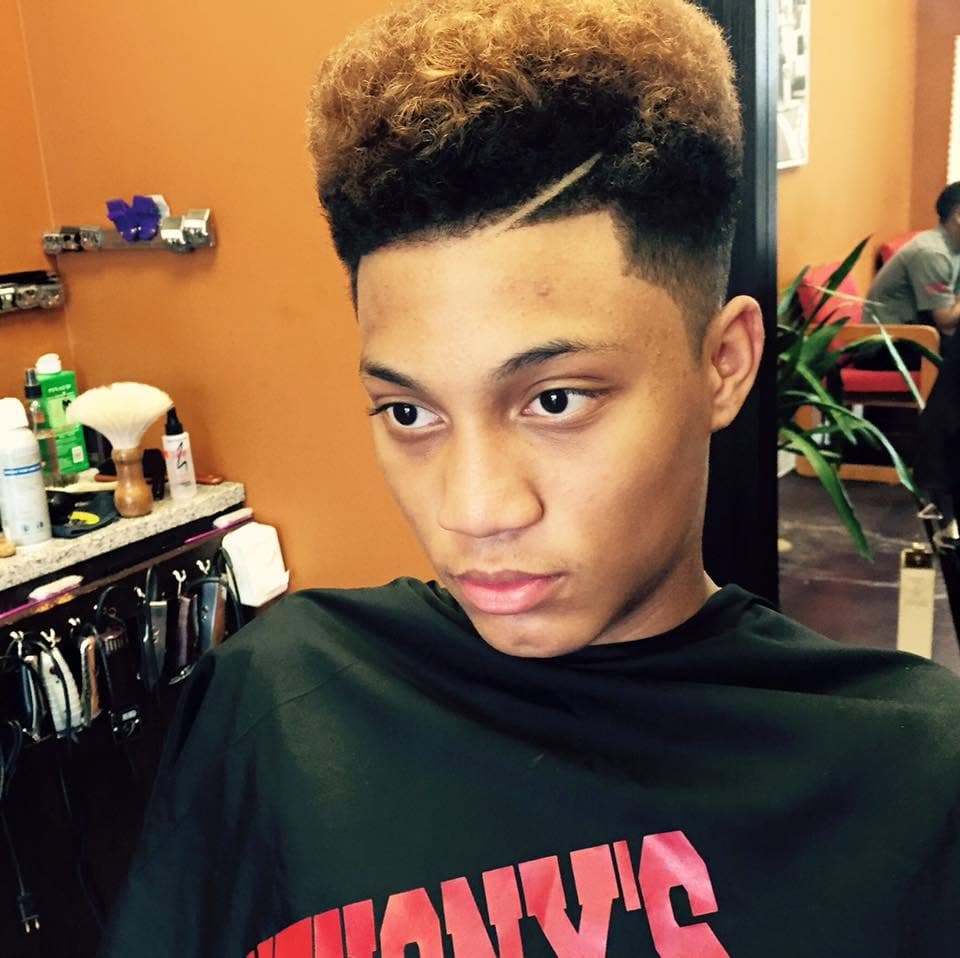 High-top fade with custom color and hard part design